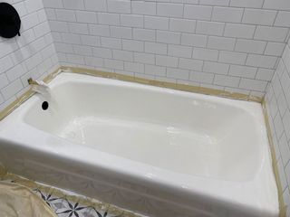 Final coat of bathtub refinishing treatment