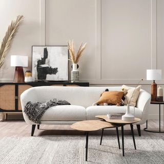 White boucle sofa in a neutral living room