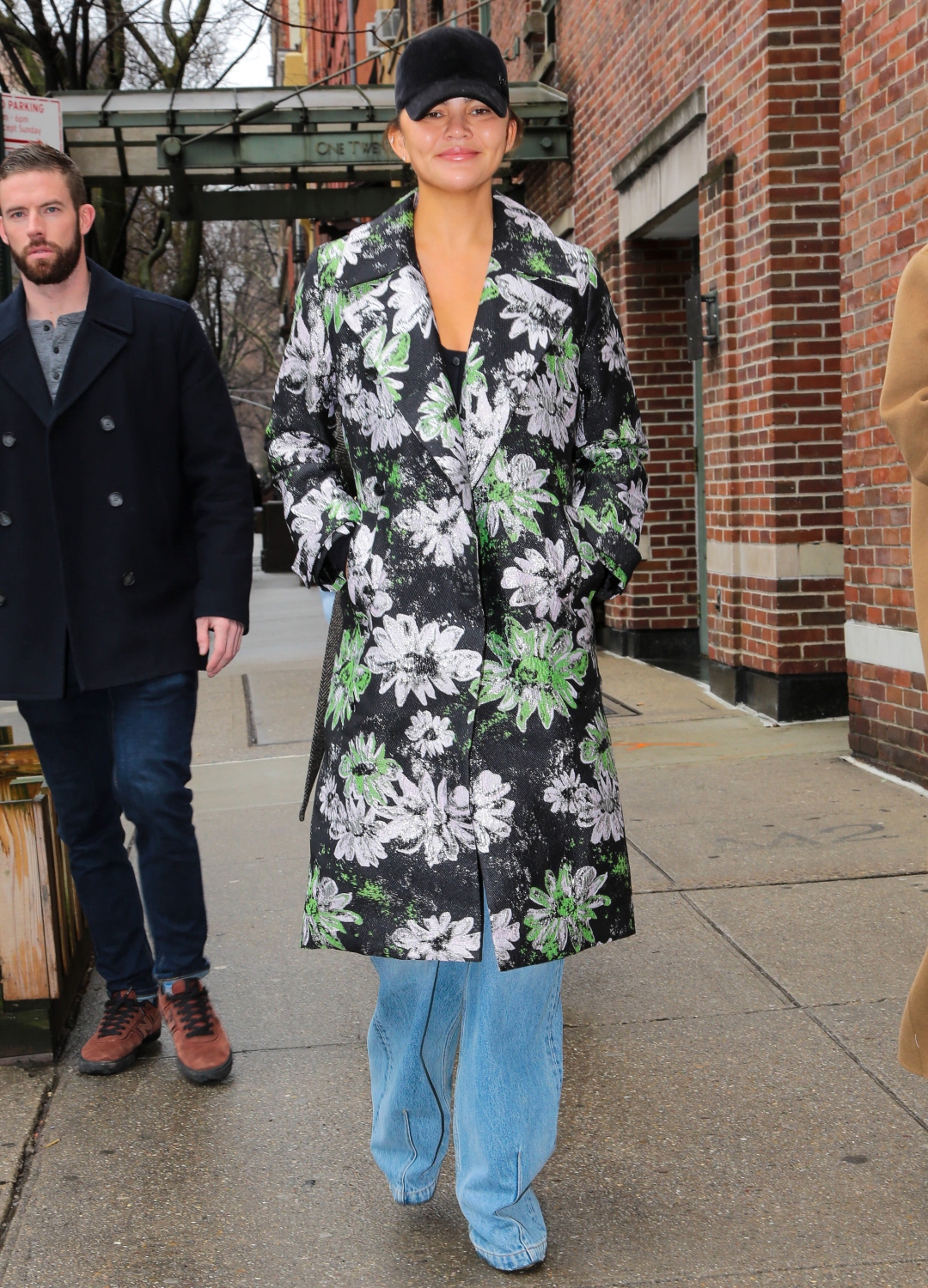 Chrissy Teigen wearing floral coat