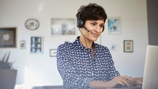 Person attending a video conference on laptop.n laptop