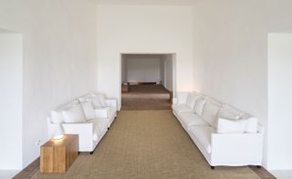 Living room with white sofas opposite each other