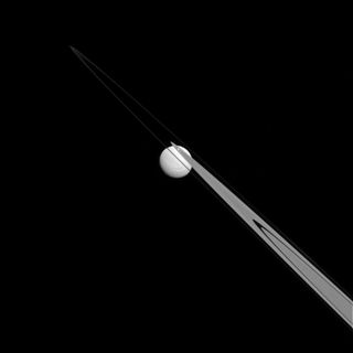 Tethys with Saturn's A and F Rings