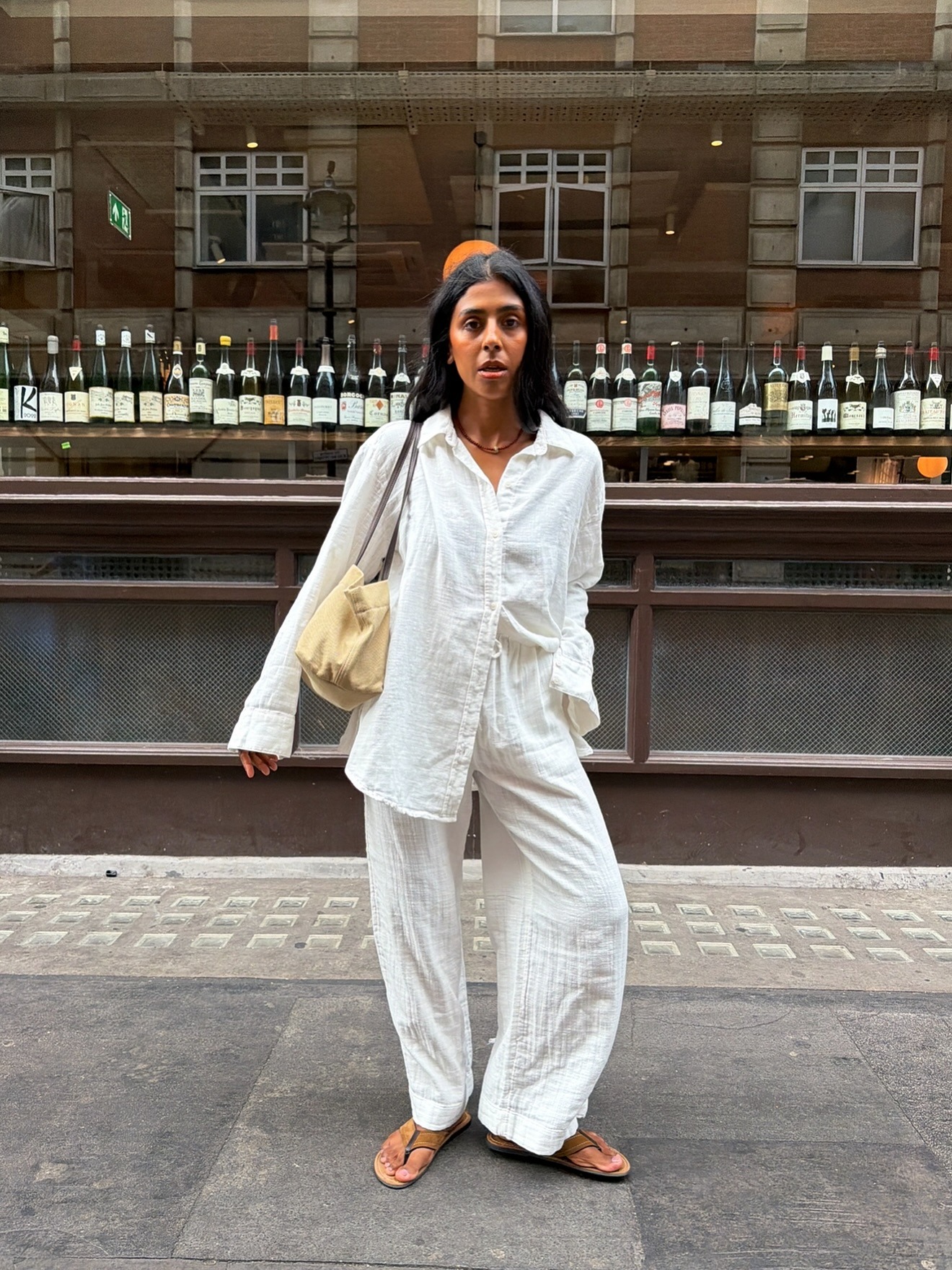 Influencer wearing button-down shirt outfit.