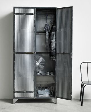 Corinda corrugated metal cabinet from Out There Interiors used as a shoe storage idea