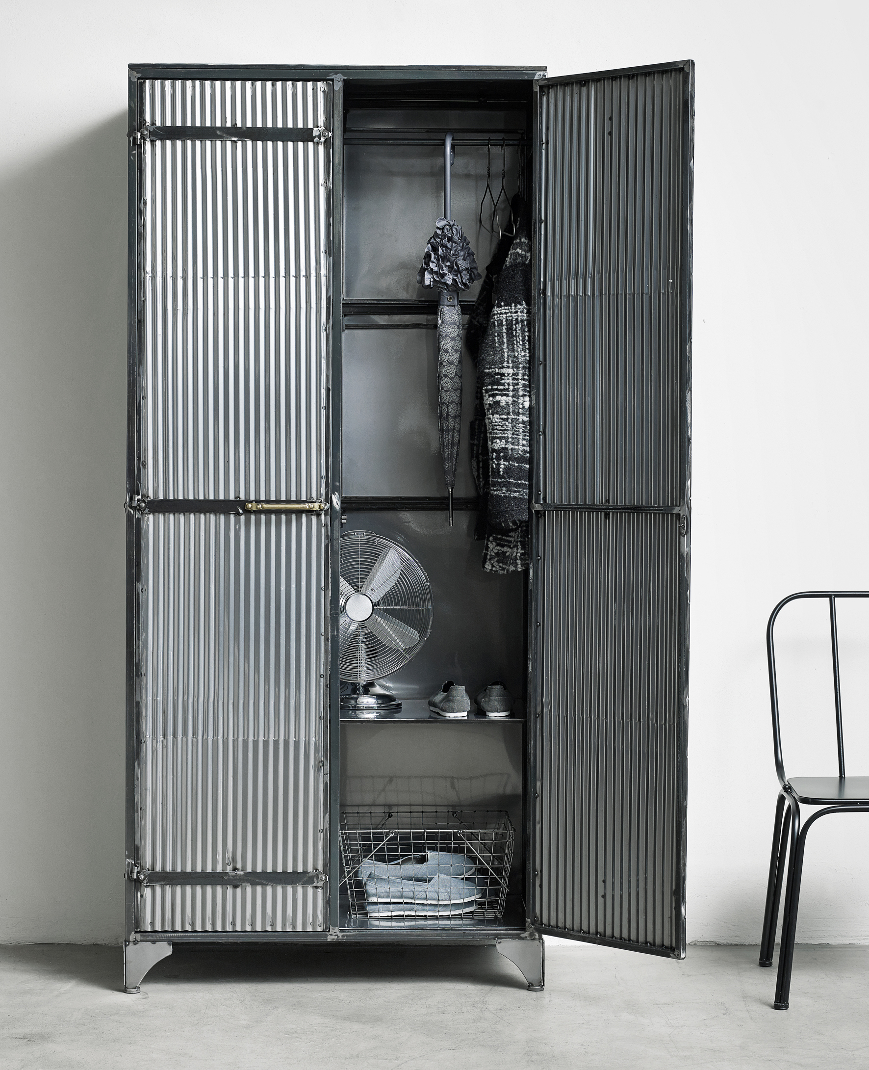 Corinda corrugated metal cabinet from Out There Interiors used as a shoe storage idea