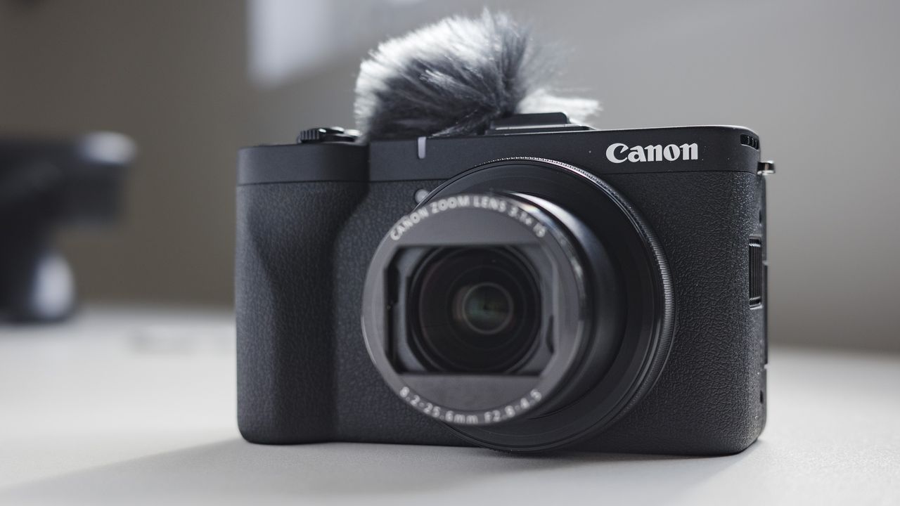Canon PowerShot V1 compact vlogging camera on a white desk