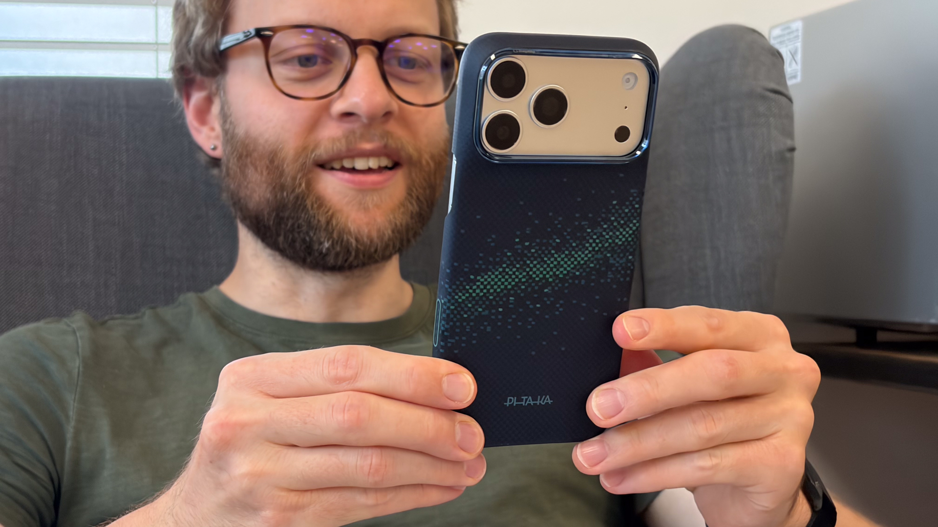 Person using an iPhone 18 Pro Max in a Pitaka case