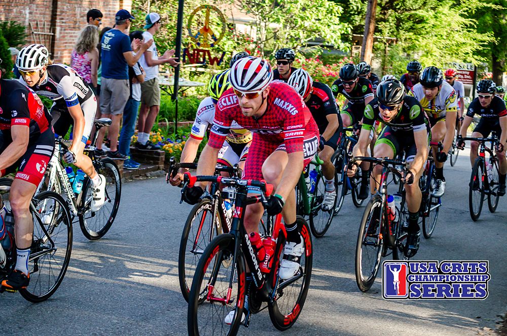 The men top the treelined hill on the backstretch