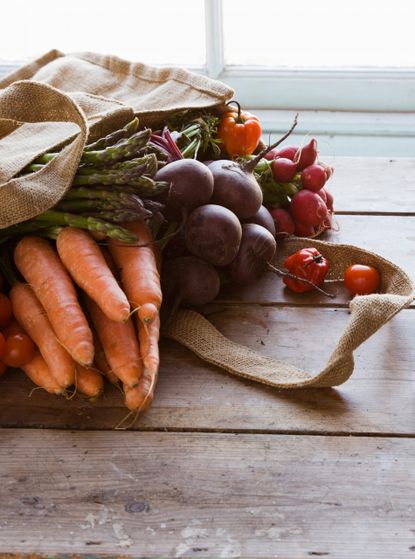 Bag with vegetables carrots tomatoes asparagus-boost your metabolism