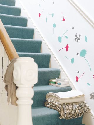 blue stair carpet with white walls