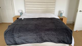 Slumberdown Cosy Hugs Heated Blanket spread over the end of the bed