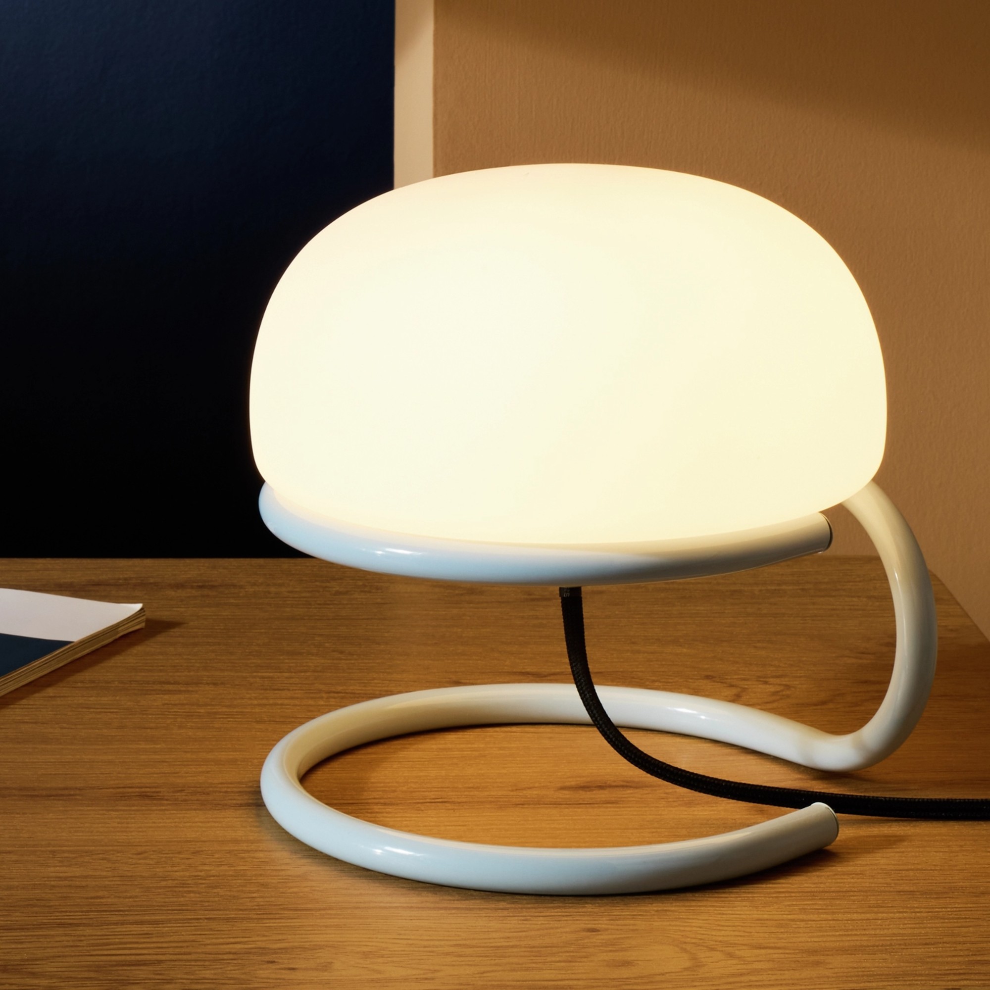 Switched on Habitat Blake Opal Glass Table Lamp on a wooden desk