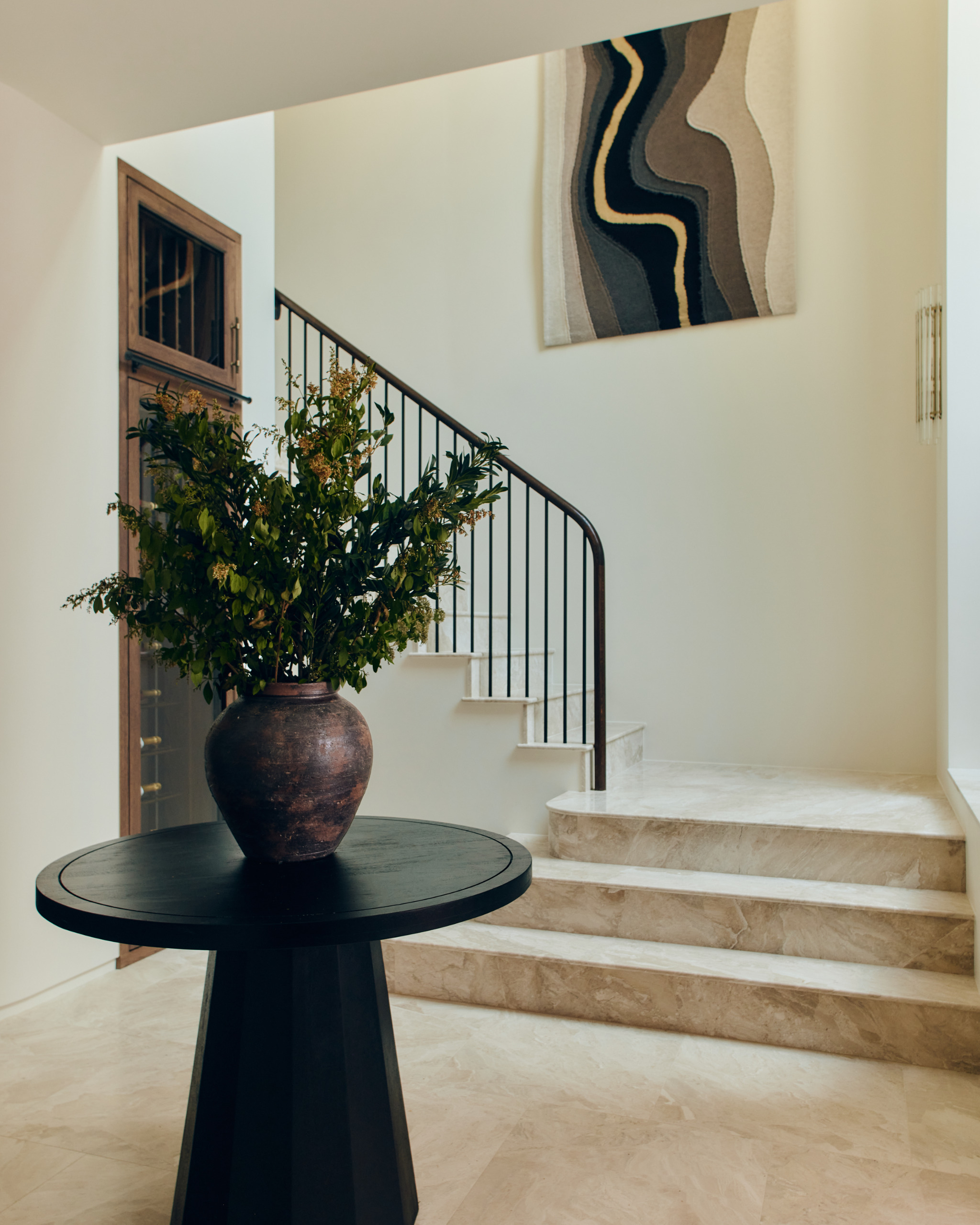Basement with wine storage and tapestry artwork on wall