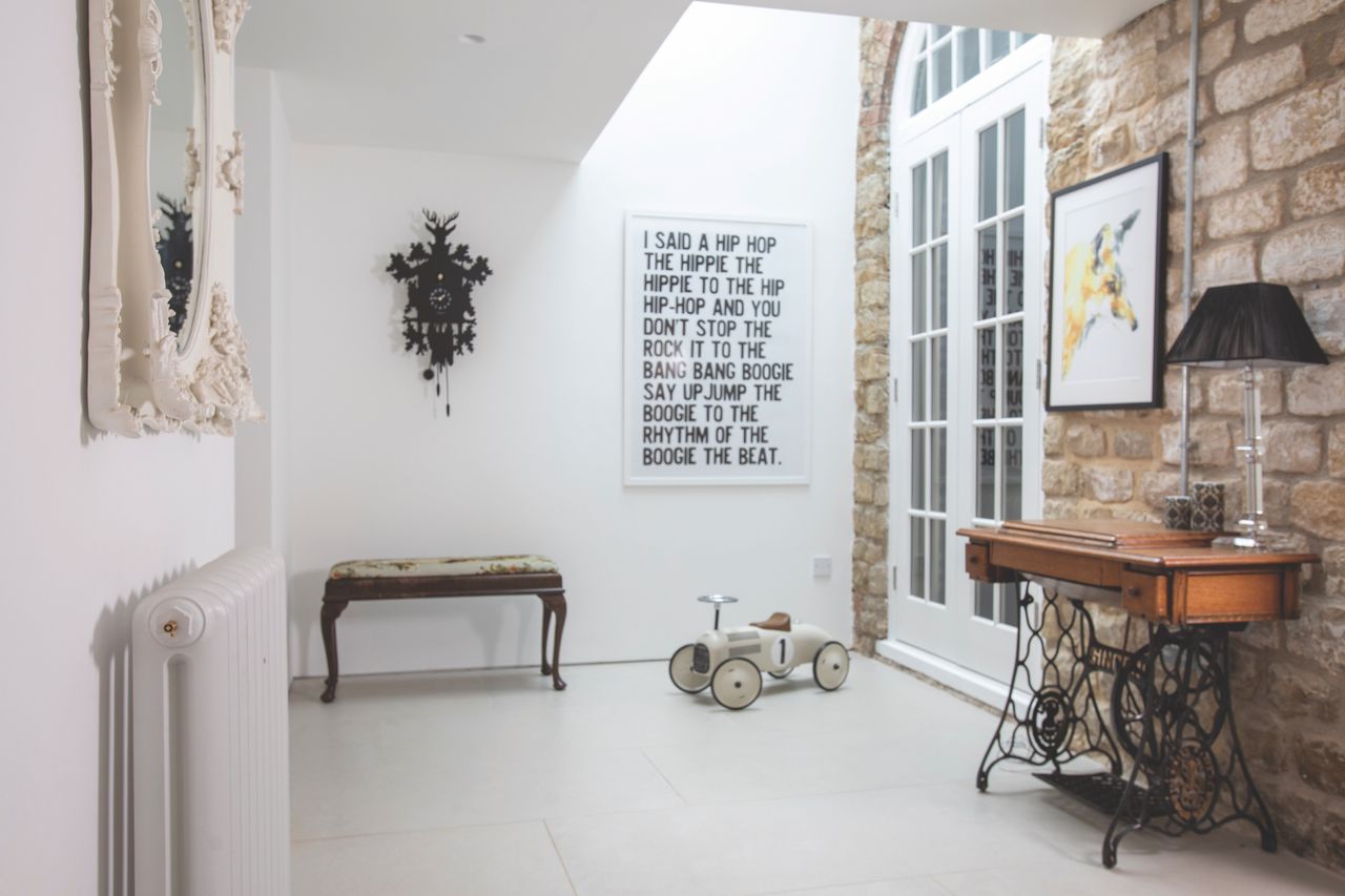 James successfully linked the old and new structures with a glazed entrance hall, which brings light into the heart of the house.