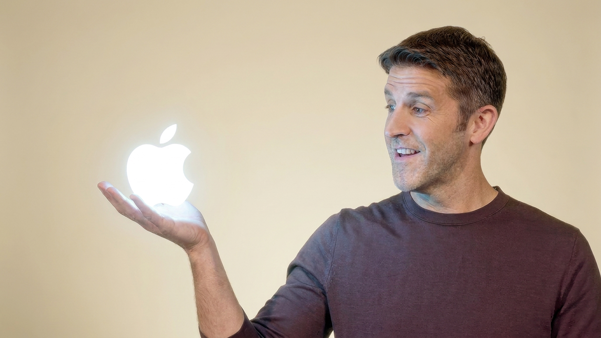John Ternus &ndash; Apple CEO &ndash; holding a glowing Apple logo in his hand