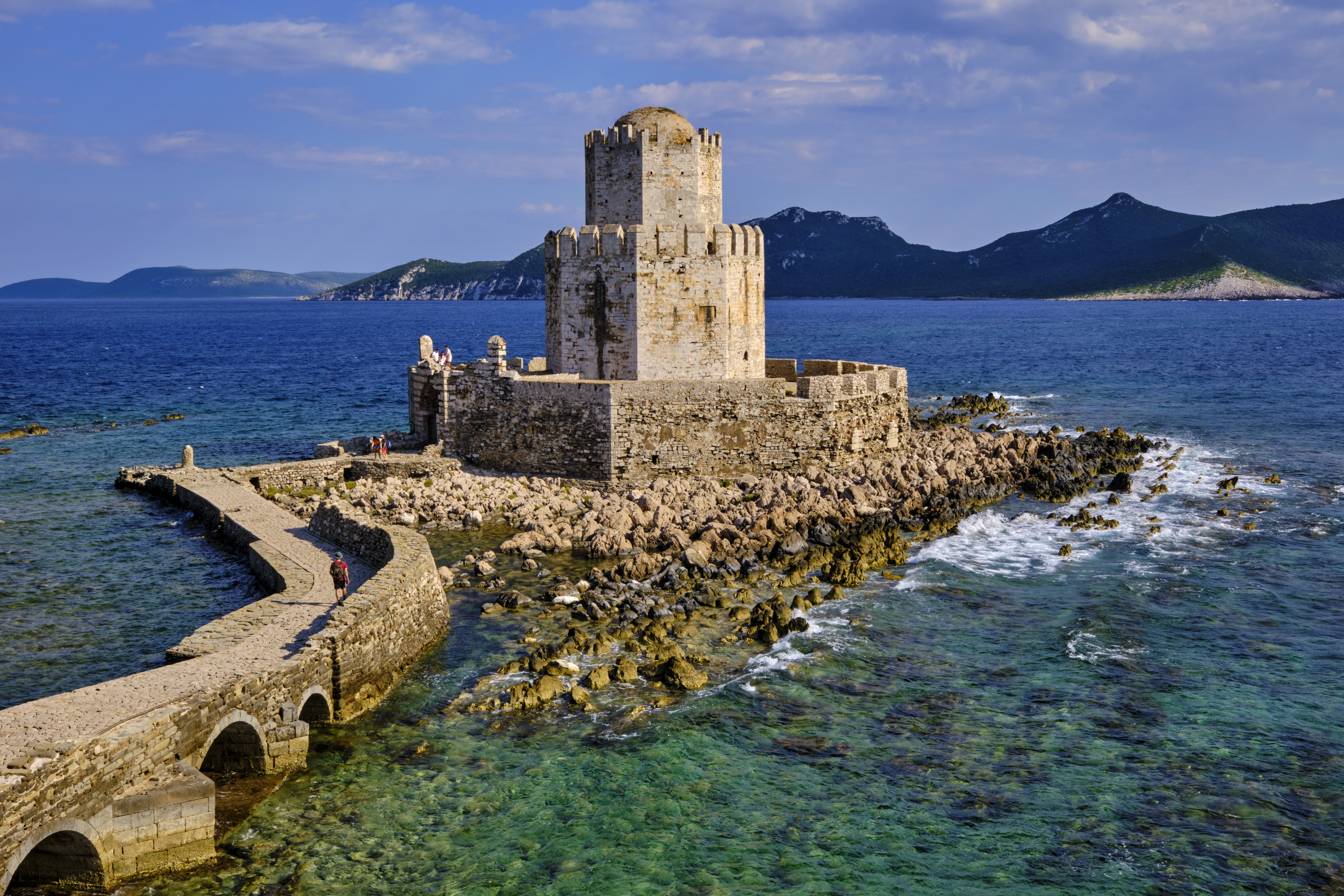 A 13th-century castle surrounded by turquoise seat