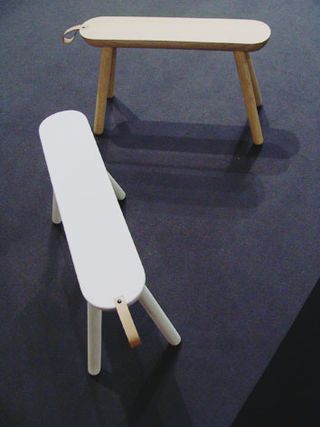 'Sheep' bench by Norrmade. Two white rounded wooden benches.