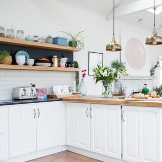 white kitchen with wood open upper shelves