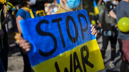 An Ukrainian woman takes part in a protest in support of Ukraine in front of the Russian Embassy in Santiago, on March 05, 2022.