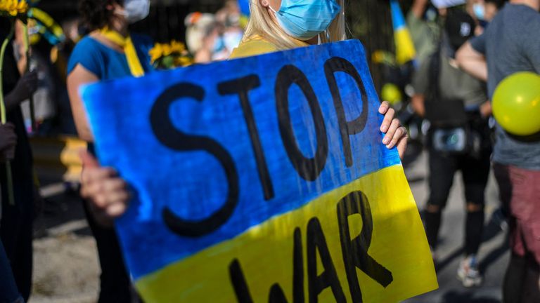 An Ukrainian woman takes part in a protest in support of Ukraine in front of the Russian Embassy in Santiago, on March 05, 2022.