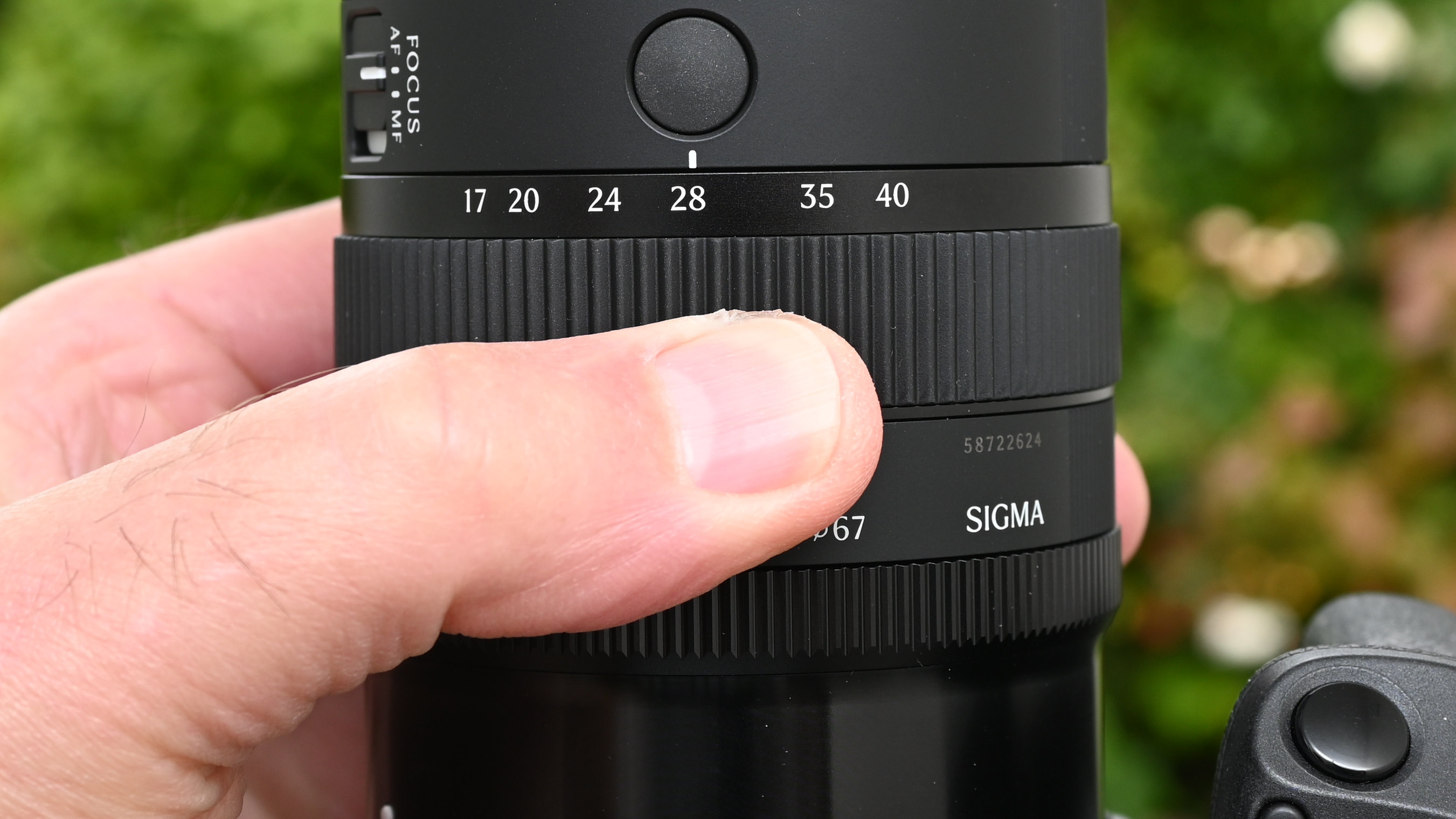 Sigma 17-40mm f/1.8 DC | A product shot held in hand