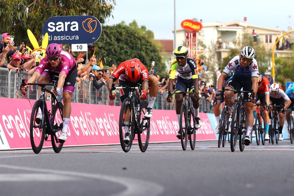 SCALEA ITALY MAY 12 LR Arnaud Demare of France and Team Groupama FDJ Purple Points Jersey Hailu Biniam Girmay of Eritrea and Team Intermarch Wanty Gobert Matriaux Caleb Ewan of Australia and Team Lotto Soudal and Mark Cavendish of United Kingdom and Team QuickStep Alpha Vinyl sprint at finish line during the 105th Giro dItalia 2022 Stage 6 a 192km stage from Palmi to Scalea Giro WorldTour on May 12 2022 in Scalea Italy Photo by Michael SteeleGetty Images