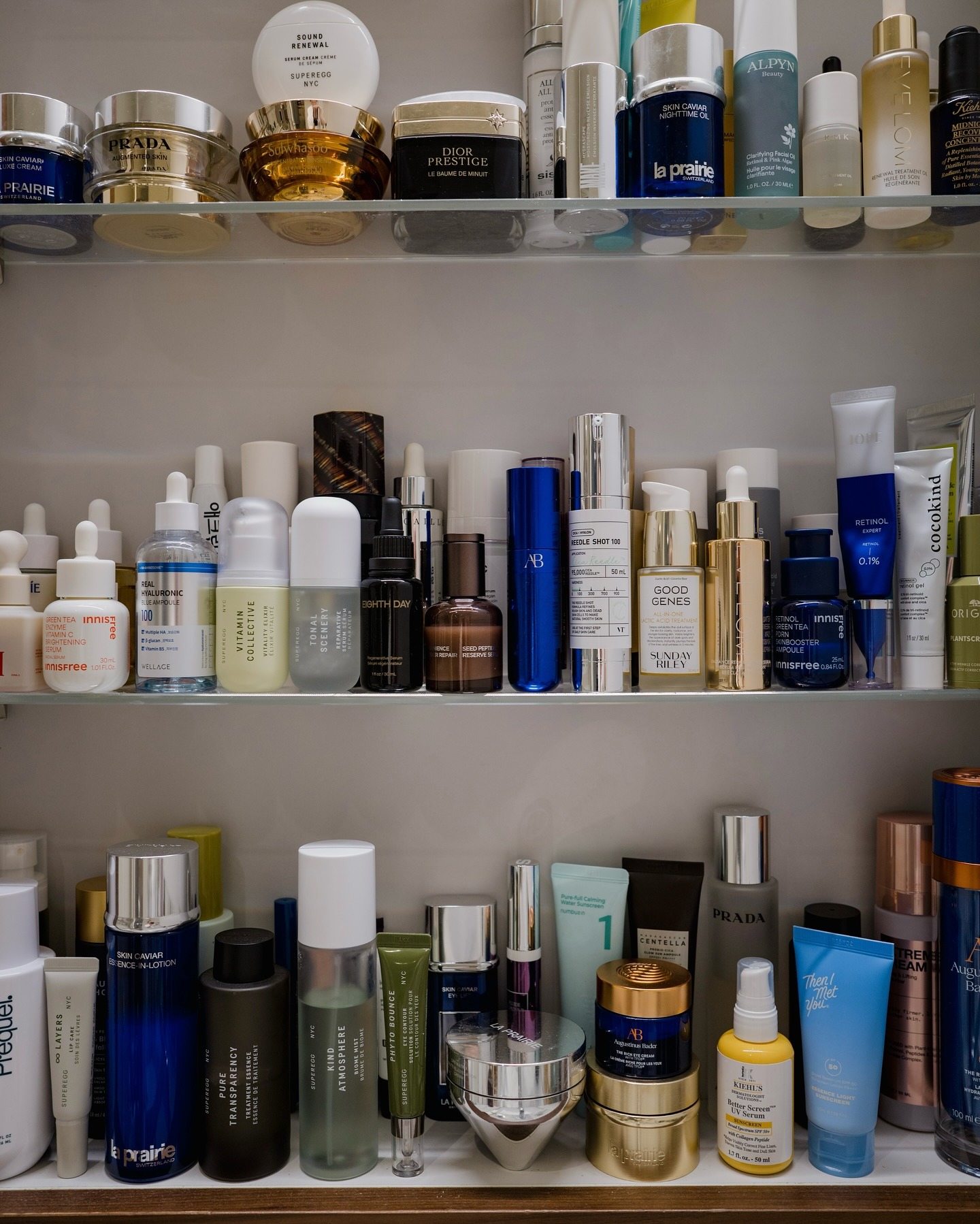 A photo of a bathroom cabinet filled with skincare products
