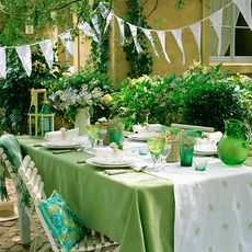 outdoor with bunting flag and green table cloth with chairs