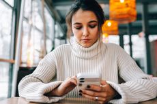 woman looking at phone