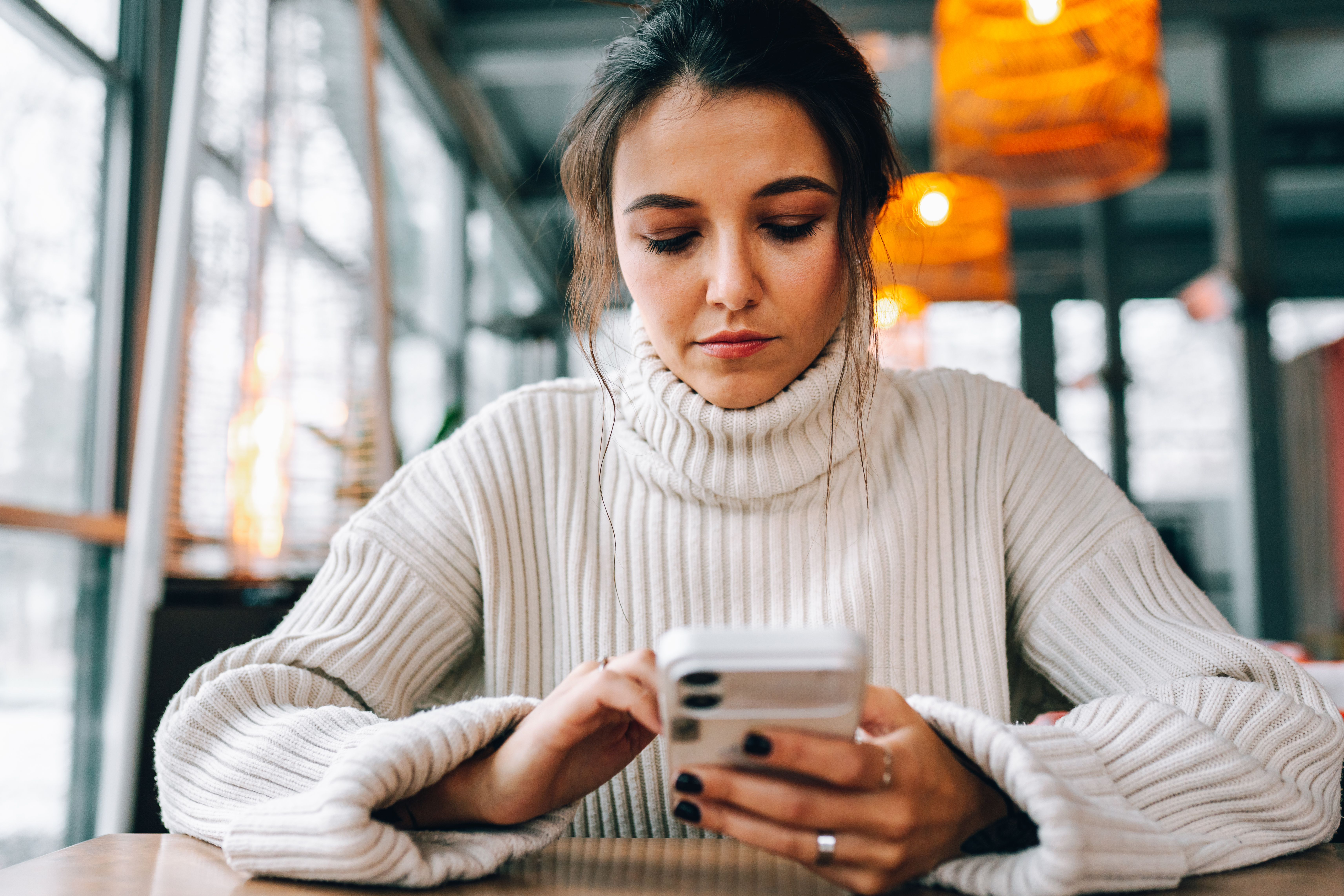 woman looking at phone