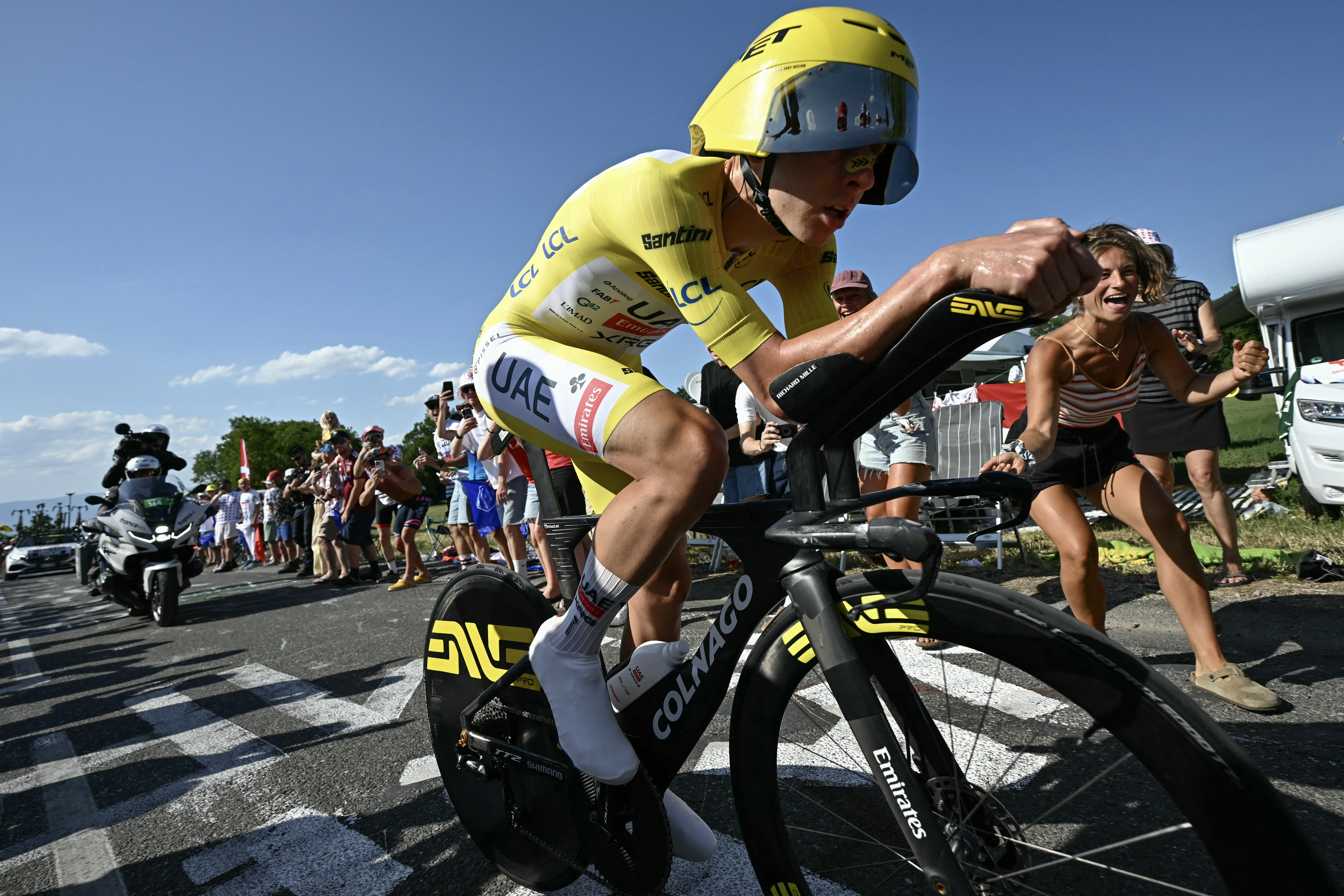 Tadej Pogacar wearing the overall leader's yellow jersey cycles during the 16th stage of the 113th edition of the Tour de France