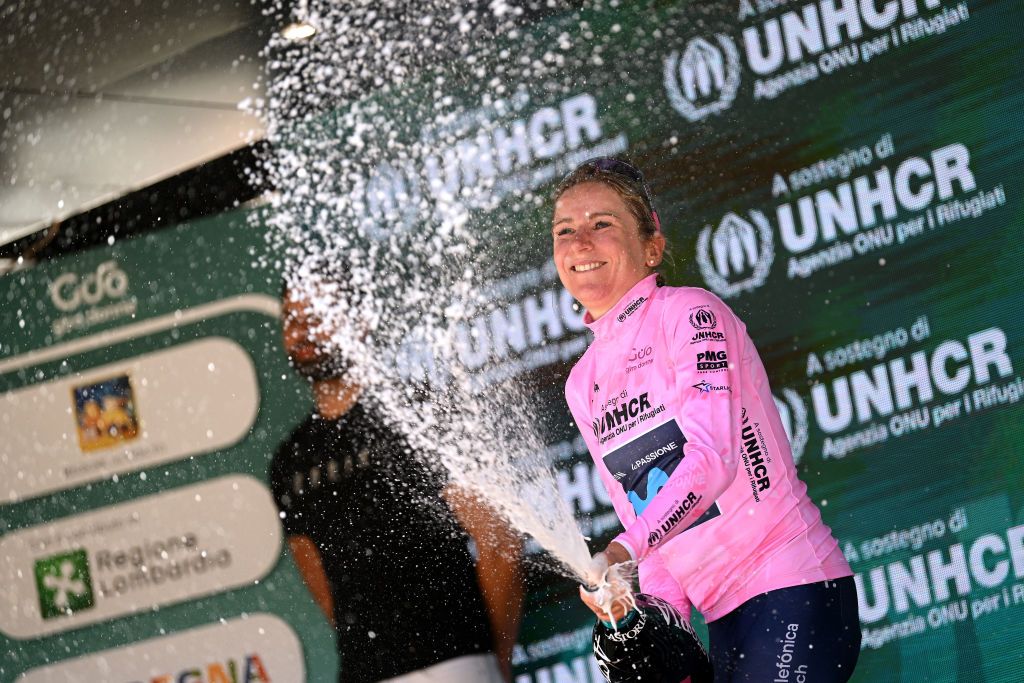 ALDENO ITALY JULY 08 Annemiek Van Vleuten of Netherlands and Movistar Team Pink Leader Jersey celebrates at podium with champagne during the 33rd Giro dItalia Donne 2022 Stage 8 a 1047km stage from Rovereto to Aldeno GiroDonne UCIWWT on July 08 2022 in Aldeno Italy Photo by Dario BelingheriGetty Images