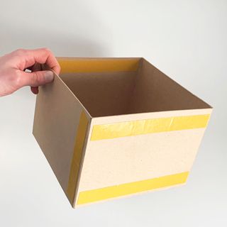 squared shaped cartboard box with dubble sided tape