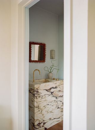 A bathroom with marble sink