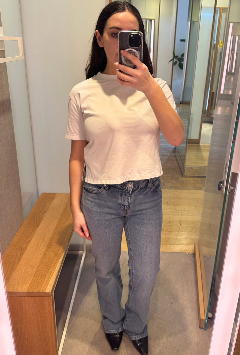 An image of Who What Wear UK SEO Writer, Ava Gilchrist, wearing Frame bootcut jeans.