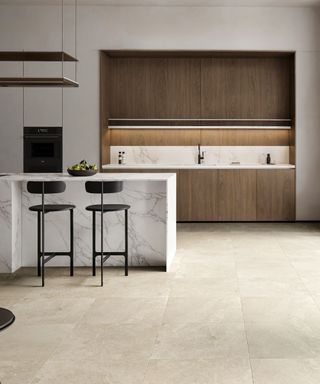 A modern kitchen decorated with warm neutral tiles