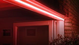 Philips Hue Outdoor Lightstrip displaying the color red outdoors