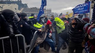 Trump supporters clash with police and security forces as people try to storm the US Capitol on January 6, 2021 in Washington, DC. Demonstrators breeched security and entered the Capitol as Congress debated the 2020 presidential election Electoral Vote Certification.
