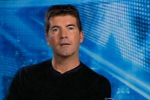 Cowell threatens X Factor judges with sack