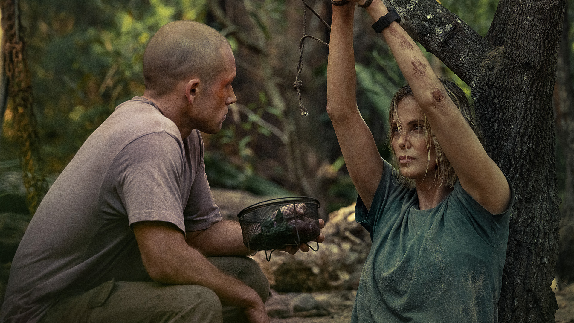 Taron Egerton as Ben and Charlize Theron as Sasha in Apex.