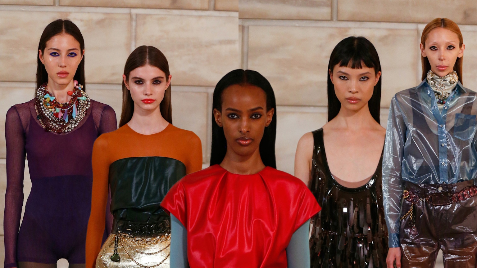 five models at the marc jacobs s/s '27 show with black eyeliner in colorful outfits