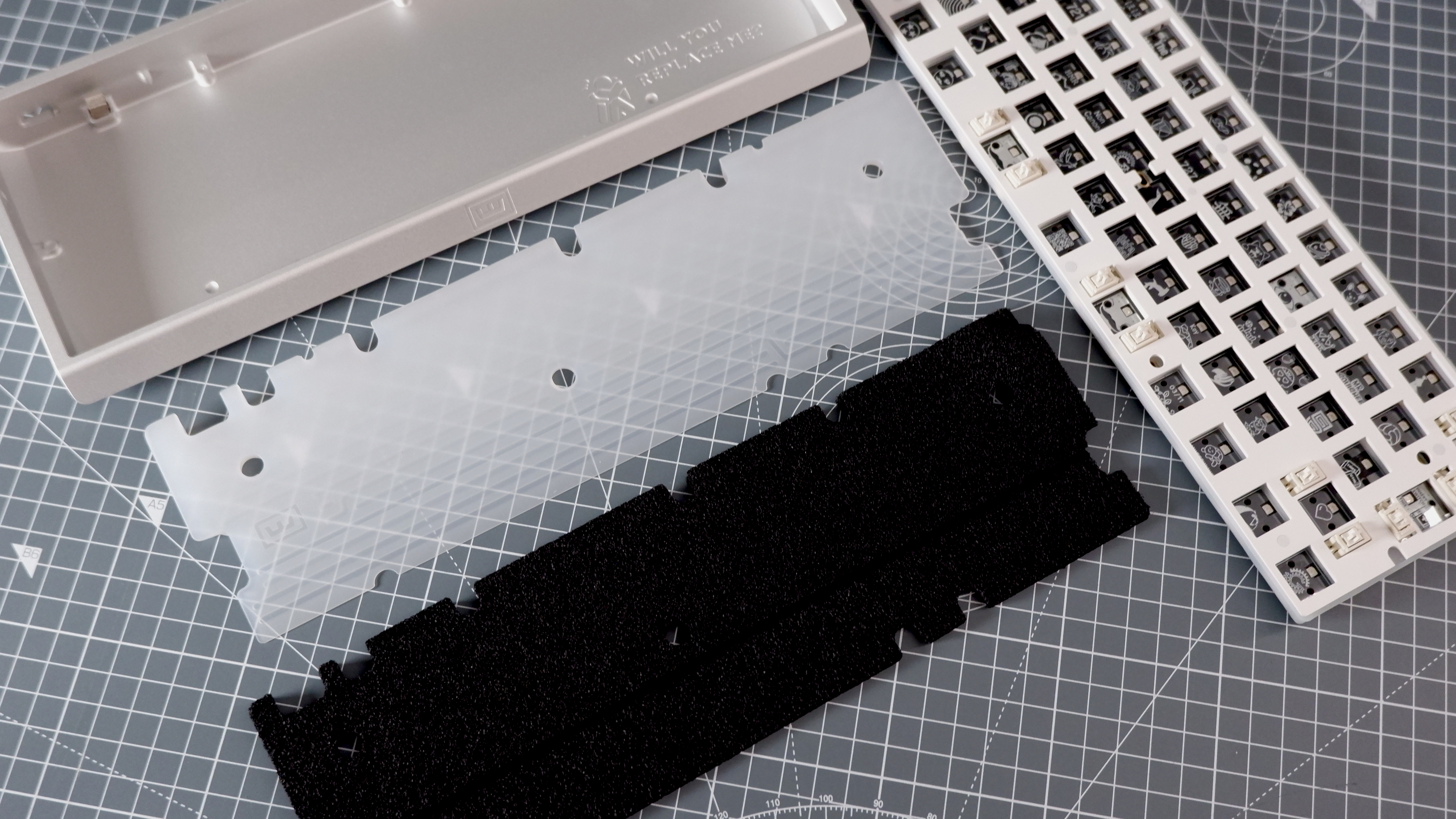 The Wooting 60HE v2 at various stages of being built.