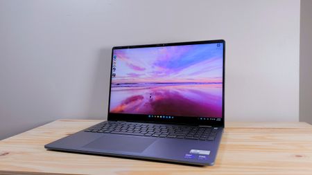 The Dell 16 Plus 2-in-1 on a wood table