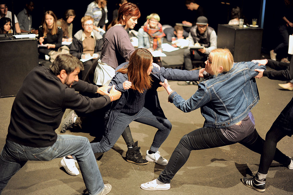 Workshop attendees pose in a group situation