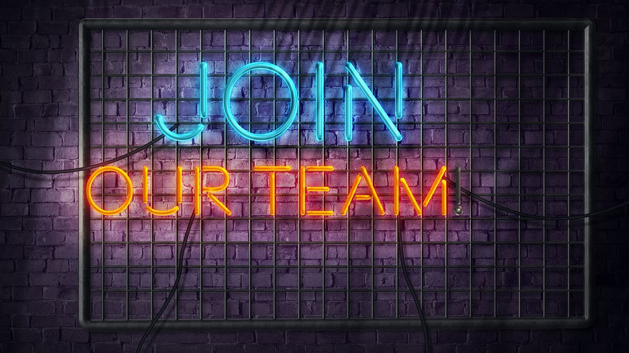 Neon sign that reads &amp;quot;Join Our Team&amp;quot; in blue and orange lights