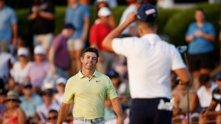 Wyndham Clark and Rory McIlroy embrace after the fourth round of the 2023 US Open