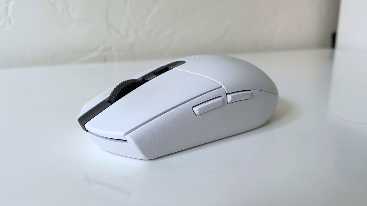 The Logitech G305 LIGHTSPEED seen from the left side on a white desk