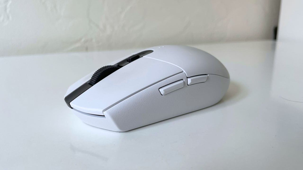 The Logitech G305 LIGHTSPEED seen from the left side on a white desk