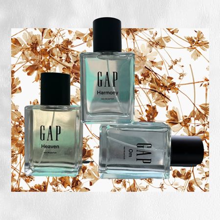 three glass bottles of Gap perfume on a brown leaf background with a white shadow edge