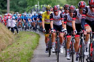 Team UAE Emirates Tadej Pogacar of Slovenia wearing the overall leaders yellow jersey 1stL rides in the pack during the 16th stage of the 108th edition of the Tour de France cycling race 169 km between Pas De La Case and SaintGaudens on July 13 2021 Photo by Thomas SAMSON AFP Photo by THOMAS SAMSONAFP via Getty Images